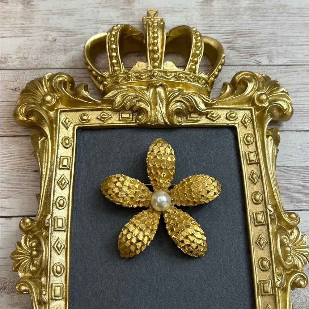 Vintage BSK gold-tone textured flower brooch with a faux pearl center.